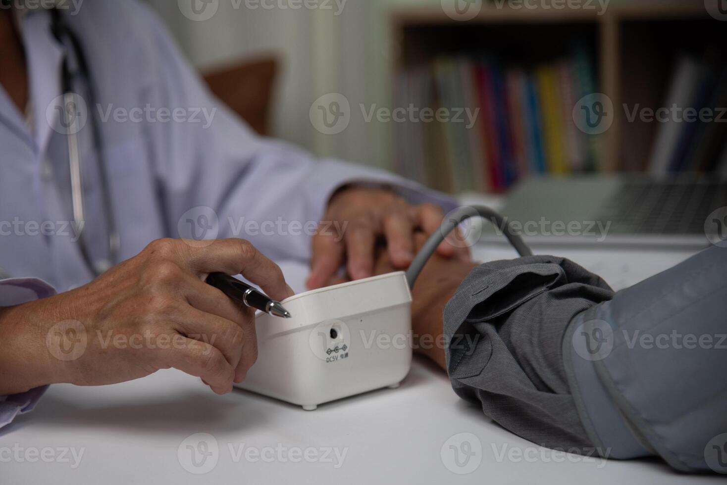 healthcare professional checking a patient's blood pressure, a vital step in medical assessment and patient care. photo