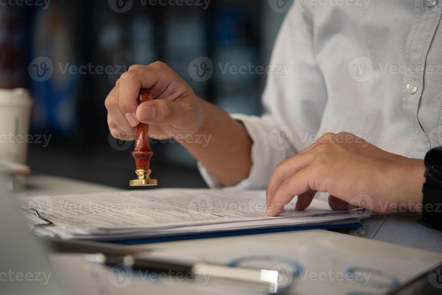 Contract law or paper work business and finance document rubber stamp. For official and legal contracts and agreements, financial statements, investment contracts, real estate documents. photo