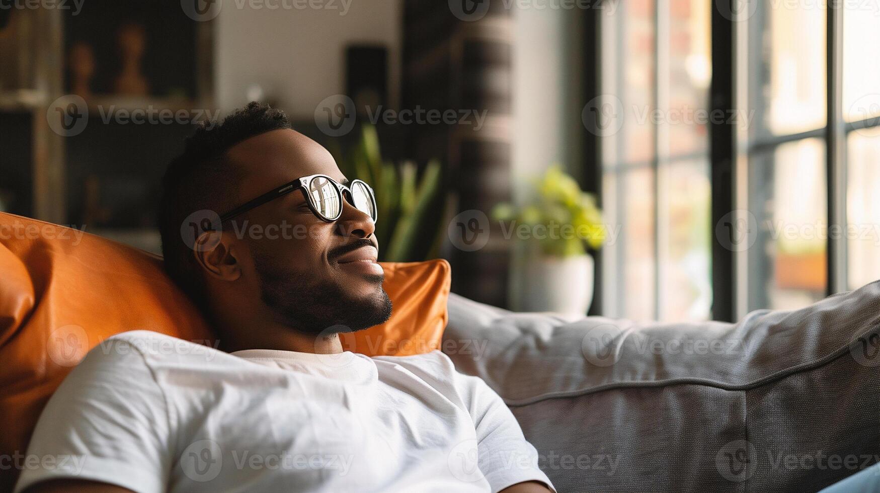 AI generated happy african american man in eyeglasses relaxing on sofa at home photo