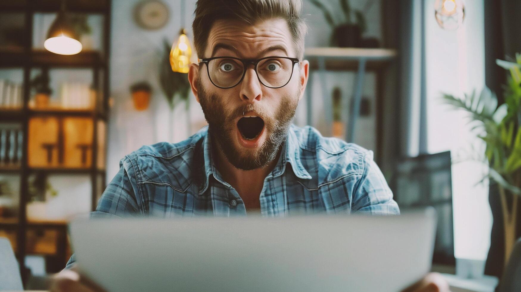 AI generated Shocked man in eyeglasses looking at laptop screen at home photo