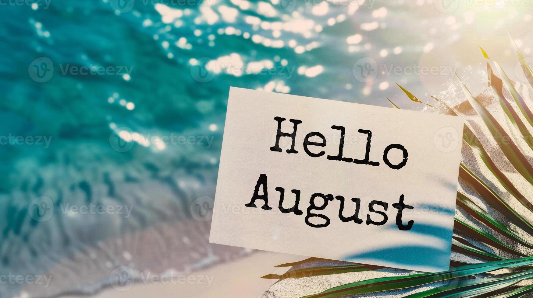 AI generated Hello August written on a card with a palm leaf on a sandy beach photo