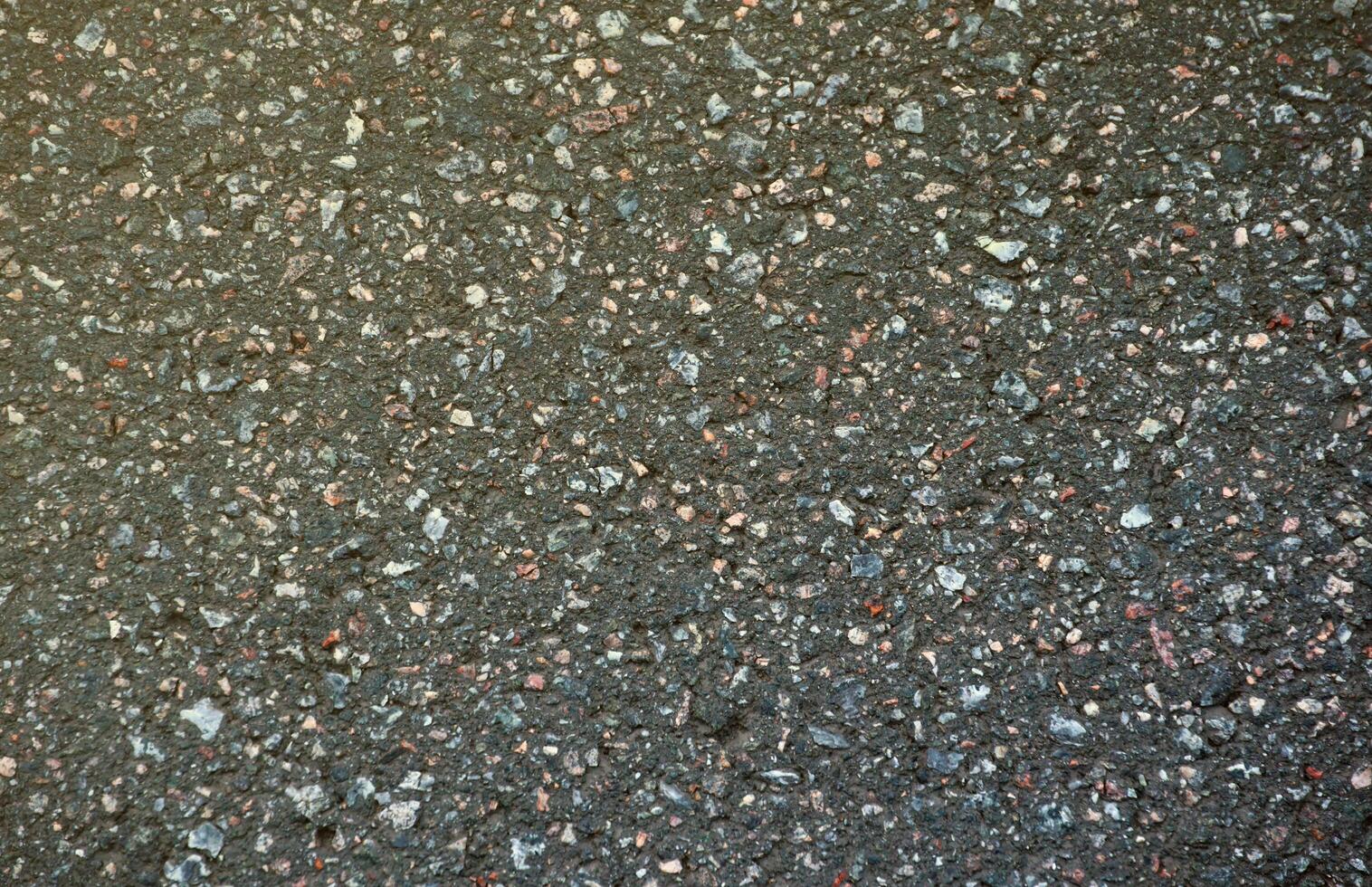 Surface grunge rough of asphalt. Tarmac dark grey grainy road. Texture Background Top view photo