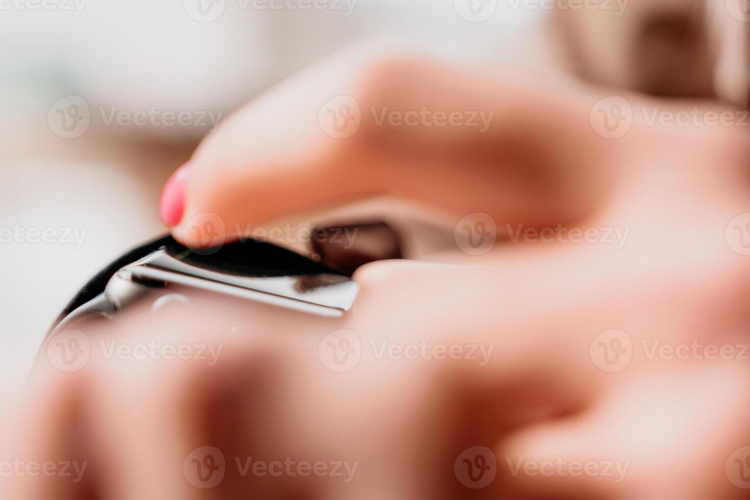 Woman hand using smart watches mobile app with touch screen. New gadget to stay connected to internet. Stylish touchscreen wrist watches with navigation mobile application. Close up. Selective focus photo