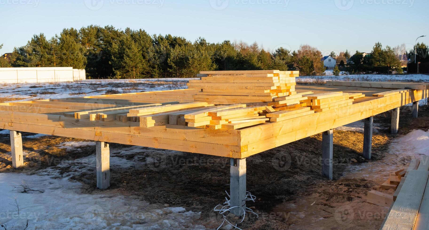 The foundation of a wooden frame house on stilts is a construction site, the process of building a frame photo