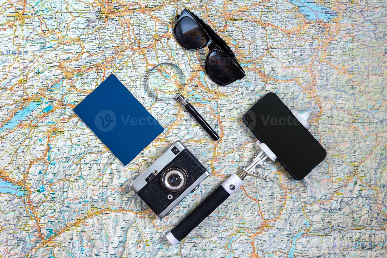 Travel accessories set on white background smart, passport, map, camera and sunglasses. Top view point. photo