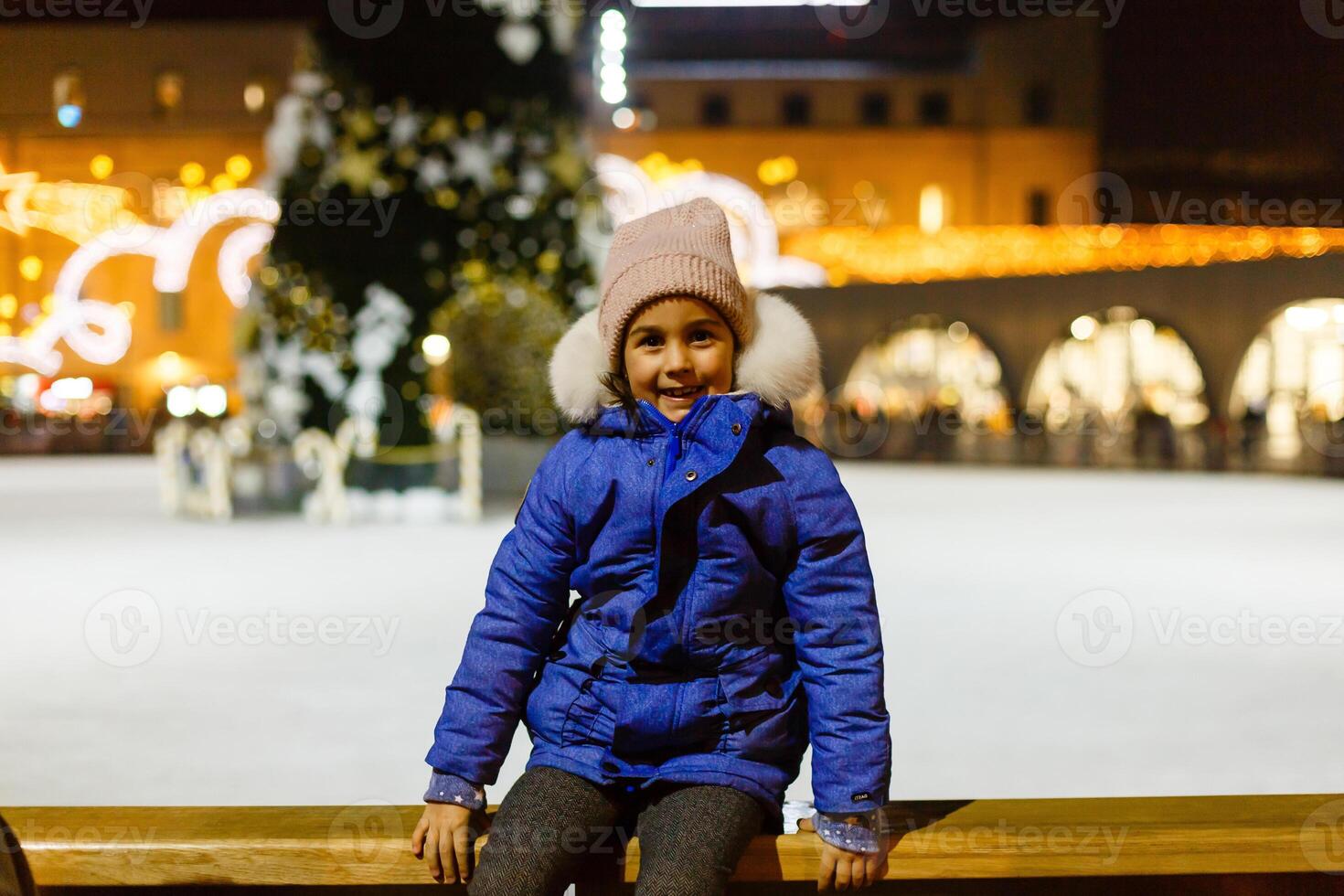 Ice skating.Active outdoor recreation, on the street. Small children skate on the rinks . photo