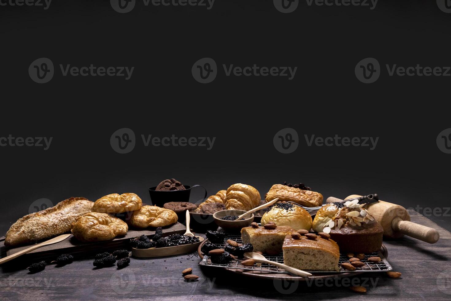 Rustic style bakery with whole grain bun, bread and cookies with various berry and nut for homemade healthy pastry and traditional baking bread photo