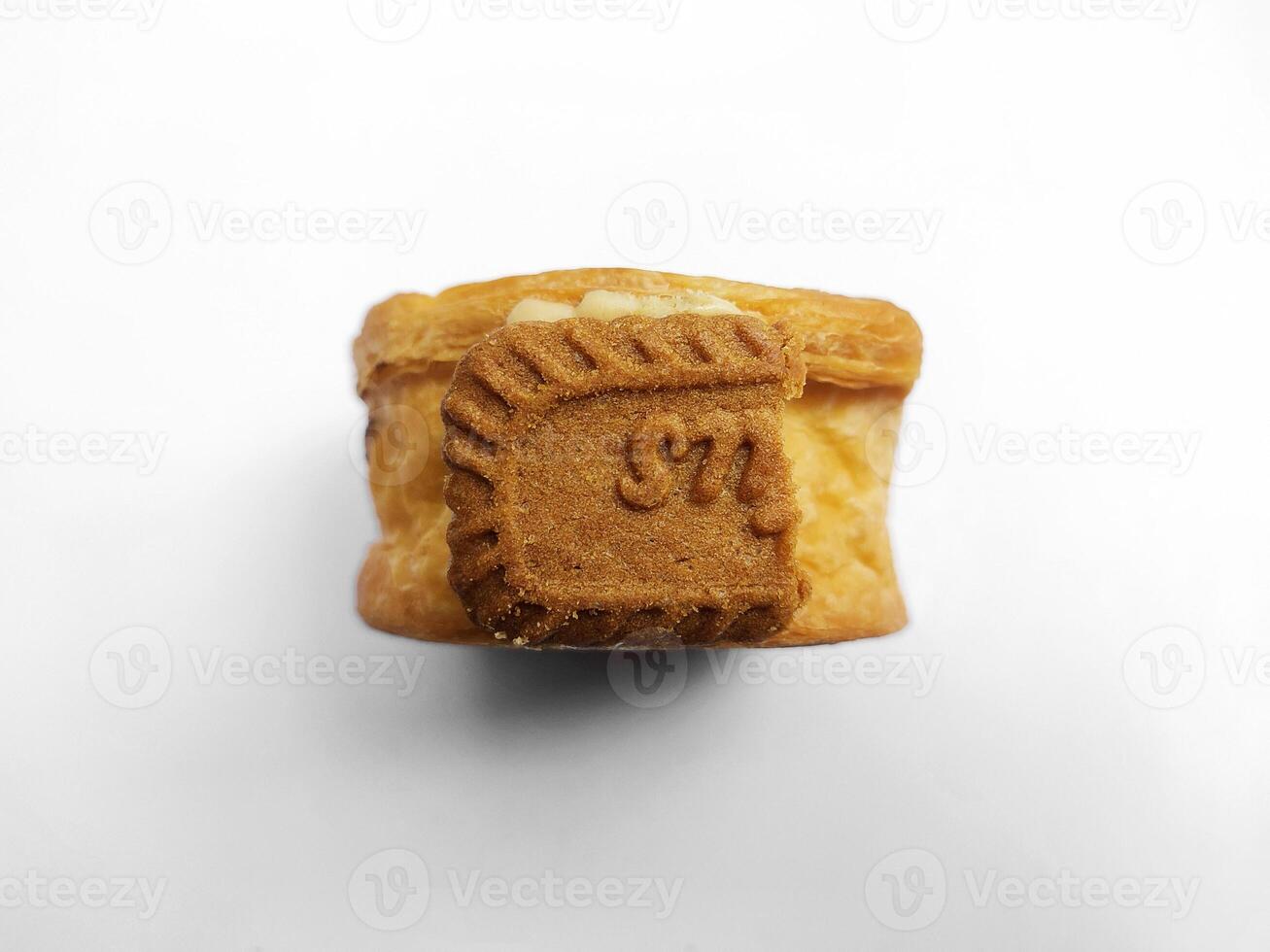 Cromboloni, New York Roll Croissant with biscoff topping, isolated white background. photo