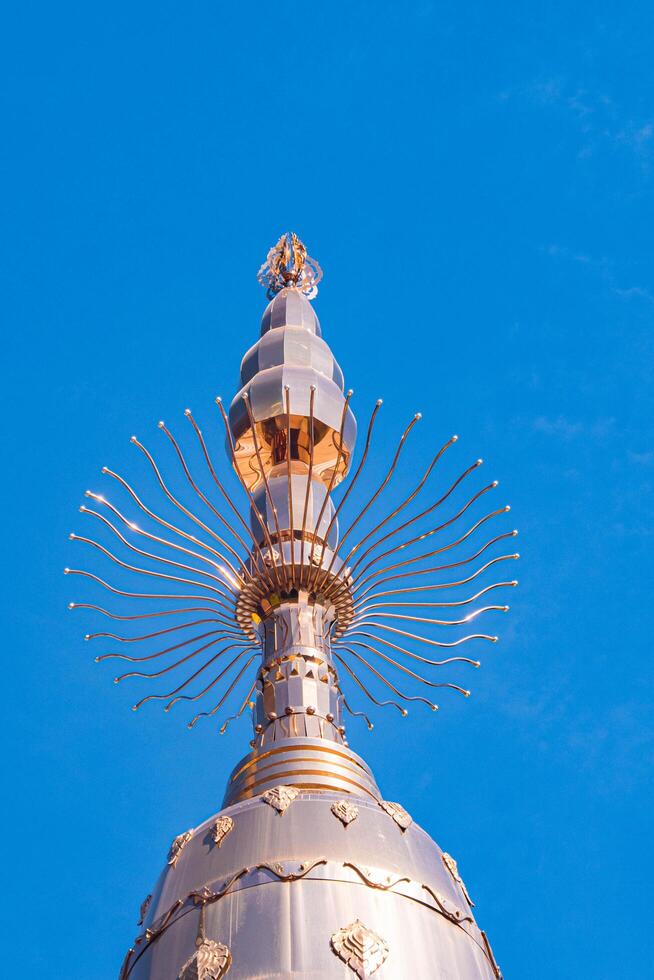 The massive aluminum-covered Buddhist stupa. photo