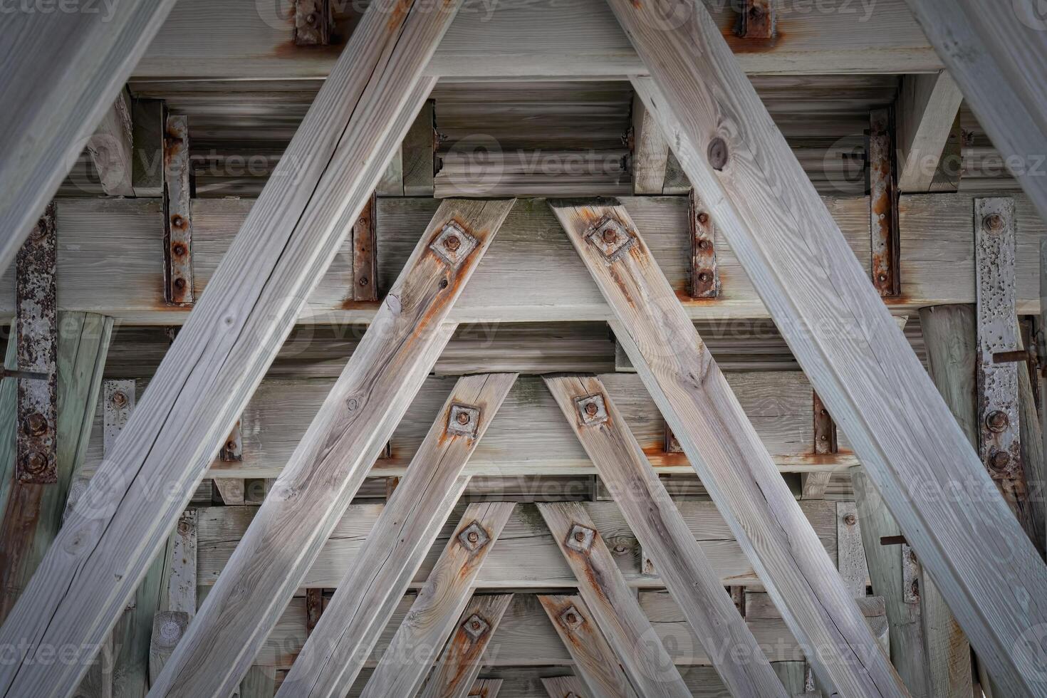 Wooden Beams Under a Fishing Pier photo