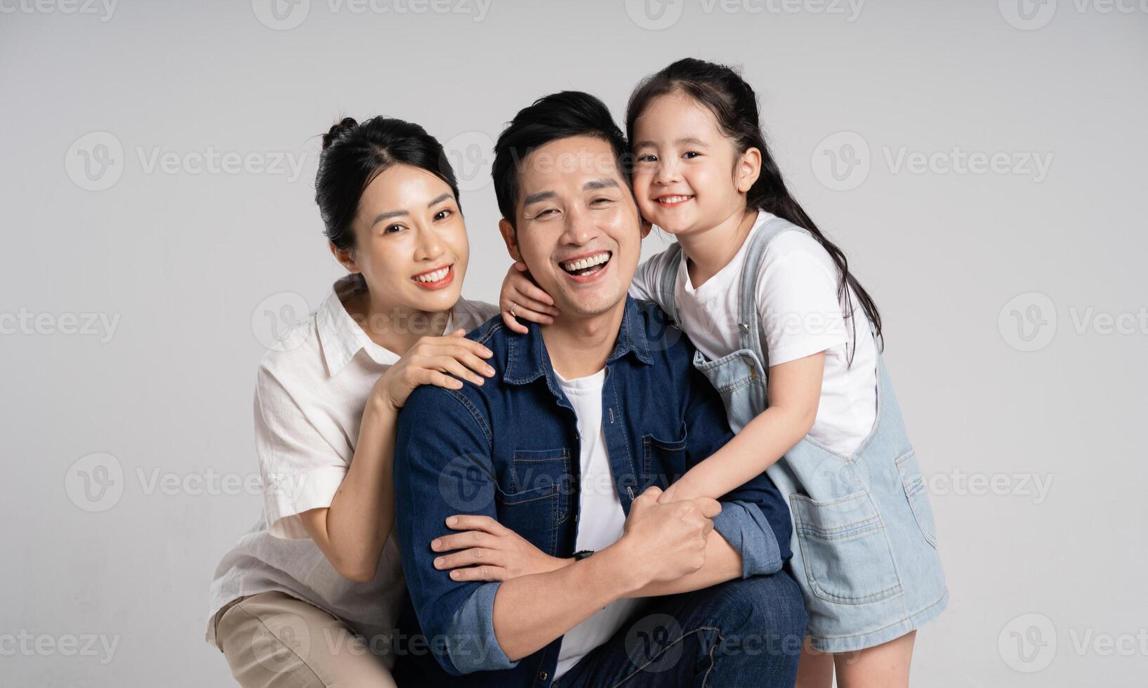 Asian family portrait posing on white background photo