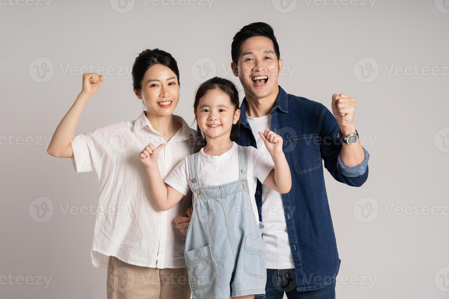 Asian family portrait posing on white background photo