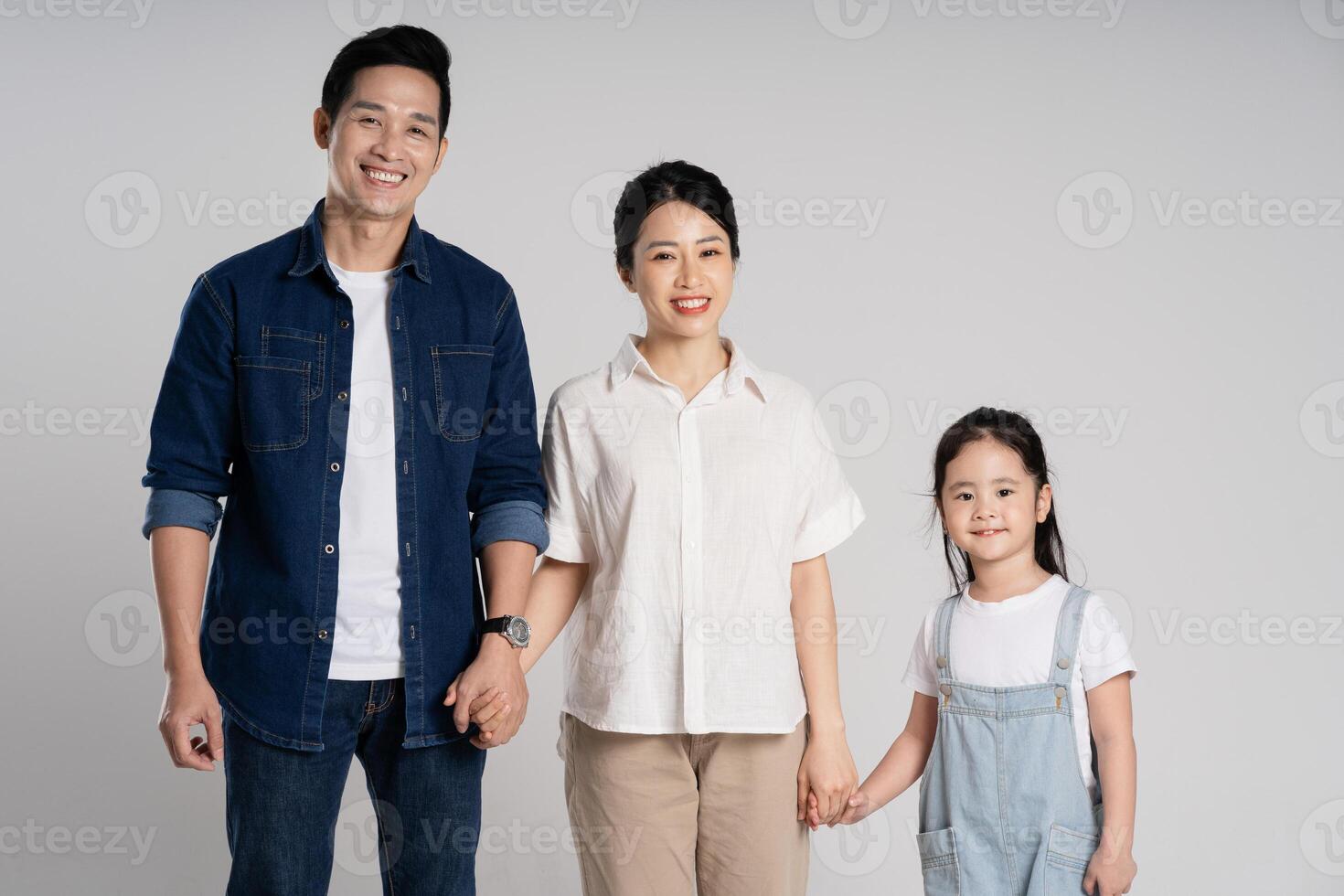 Asian family portrait posing on white background photo