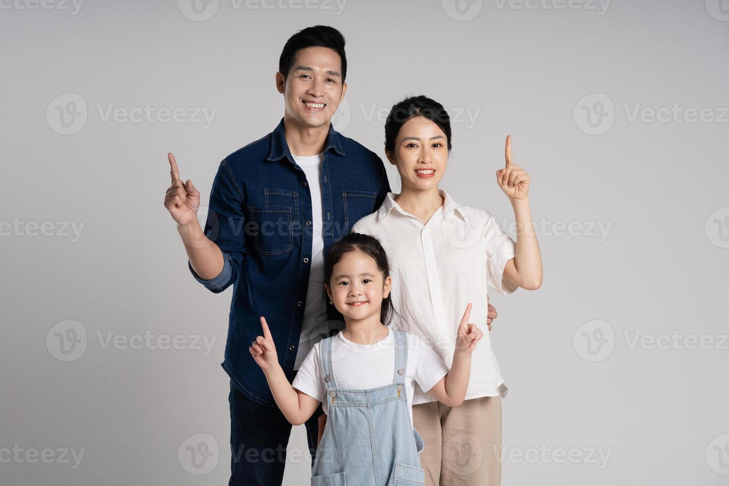 Asian family portrait posing on white background photo