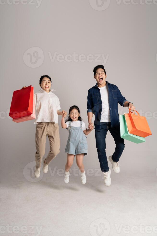 Asian family portrait posing on white background photo