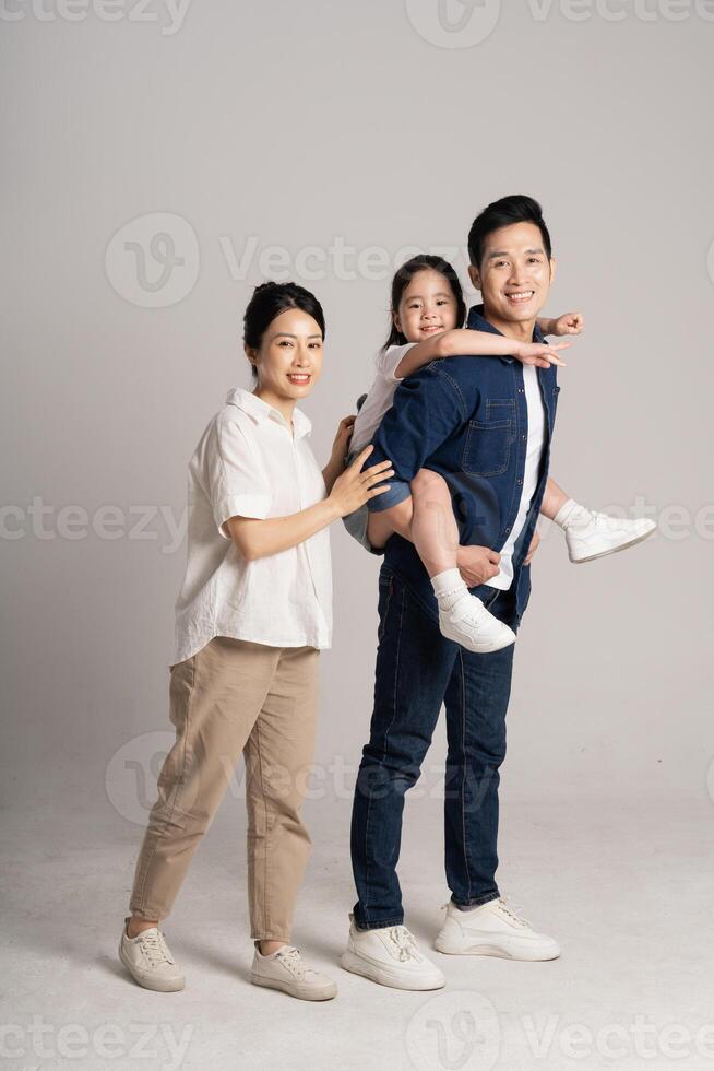Asian family portrait posing on white background photo