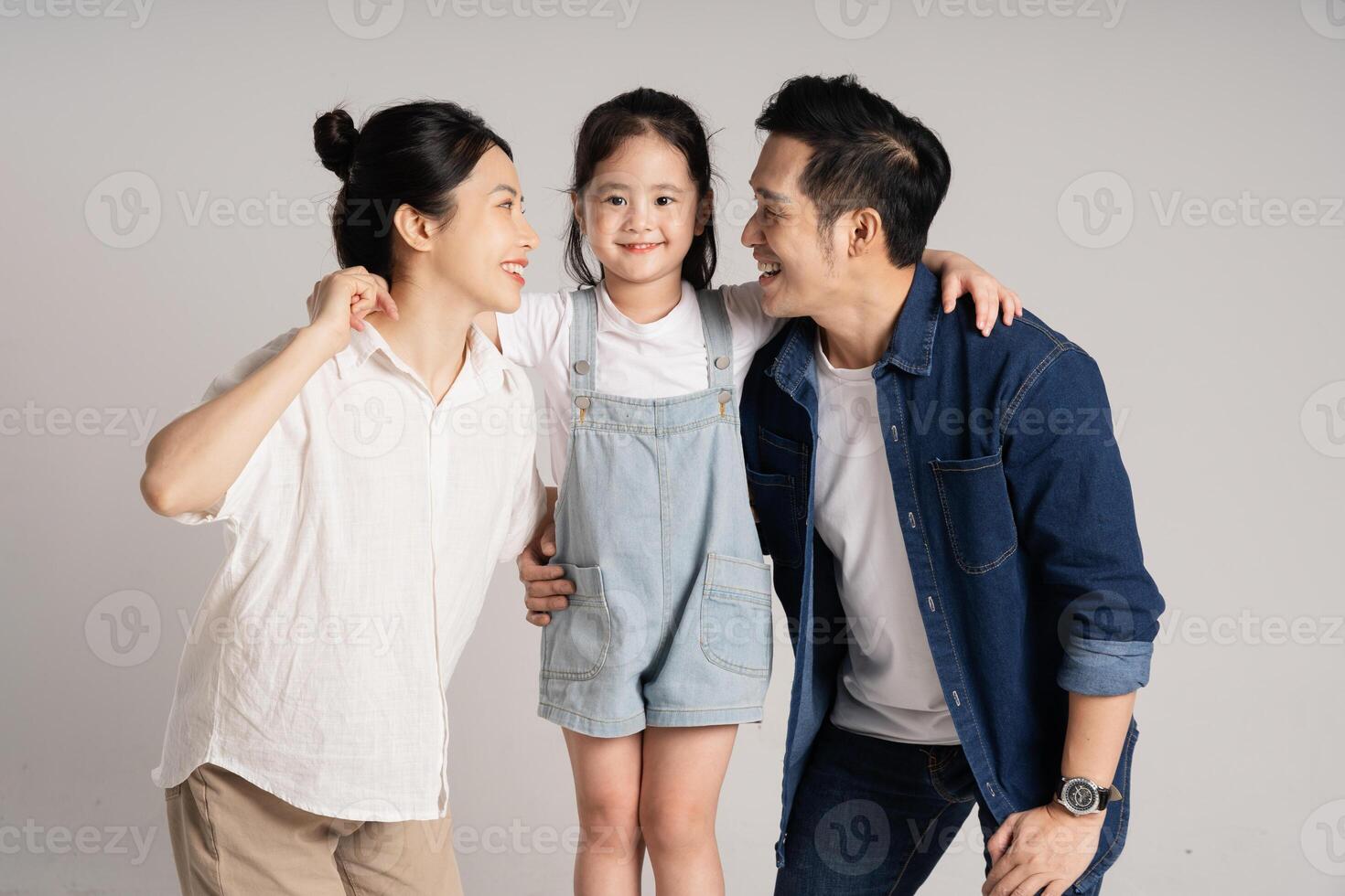 Asian family portrait posing on white background photo