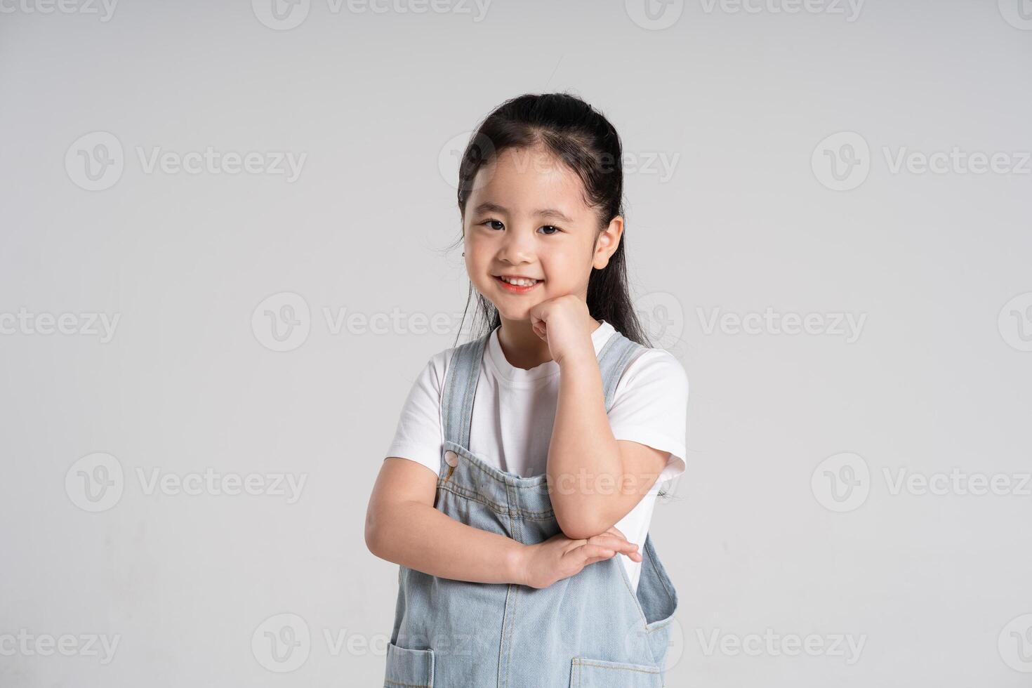 Portrait of a lovely Asian baby girl posing on a white background photo