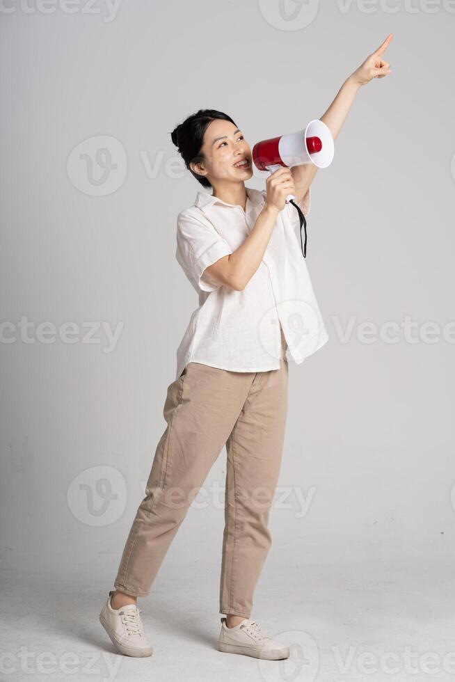 Portrait of beautiful asian woman posing on white background photo
