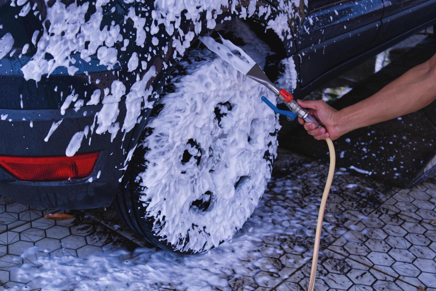 Worker washing car photo