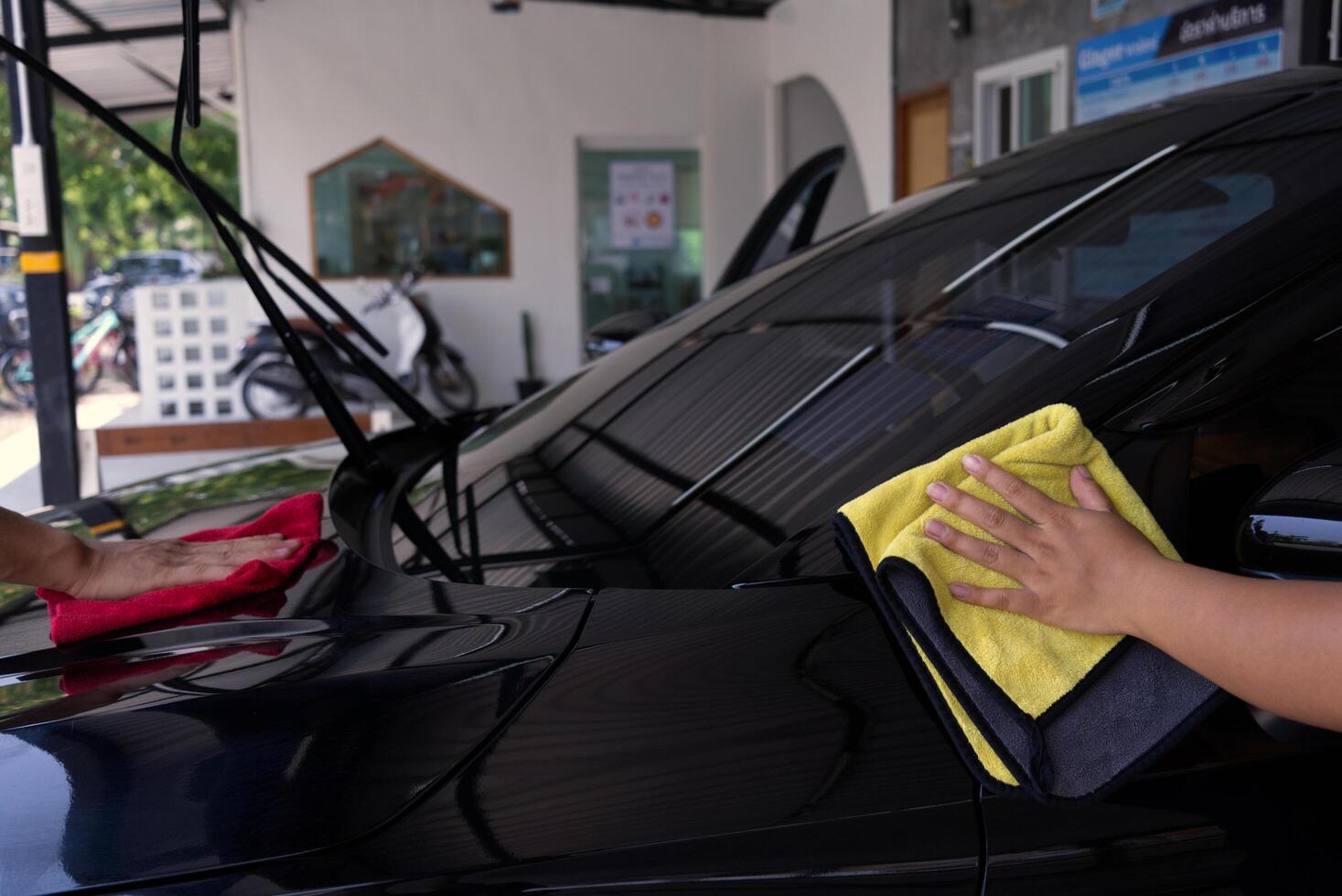 Worker washing car photo