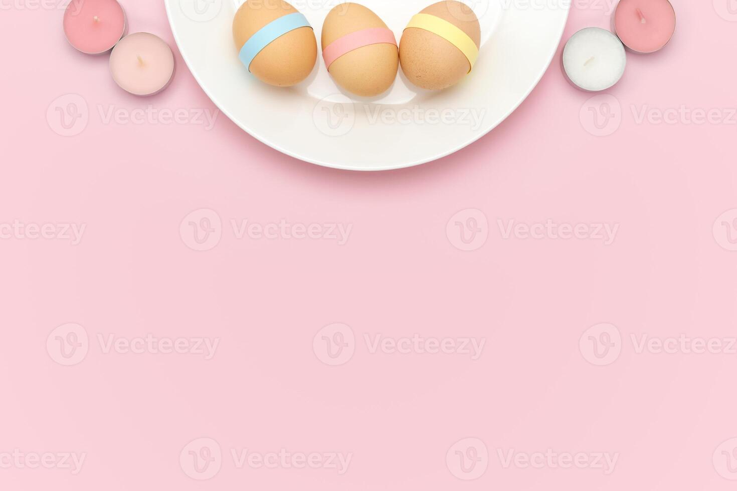 Decorated egg on a plate with candles. Easter background photo