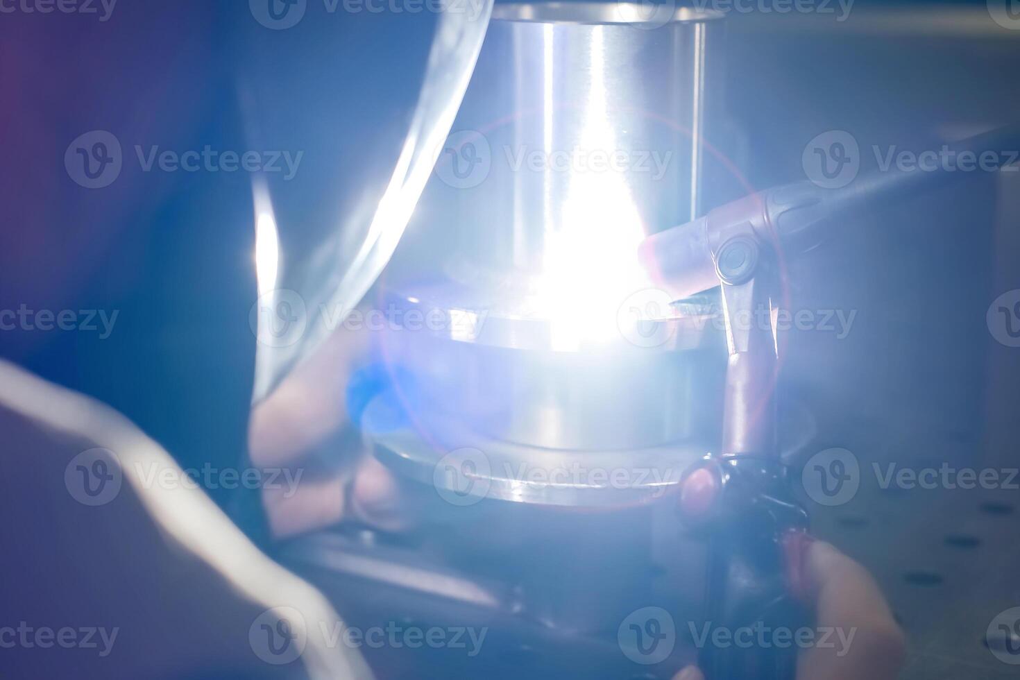 Closeup industrial Worker at the factory welding, Worker welding at industrial factory. photo