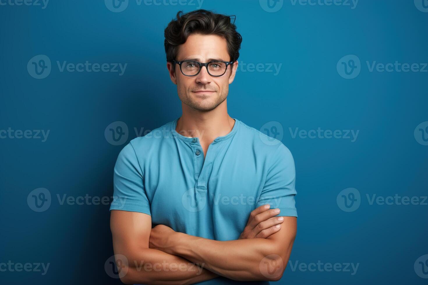 AI generated Adult confident caucasian man in t-shirt and glasses folded his hands together on blue background, waist-length studio male portrait photo