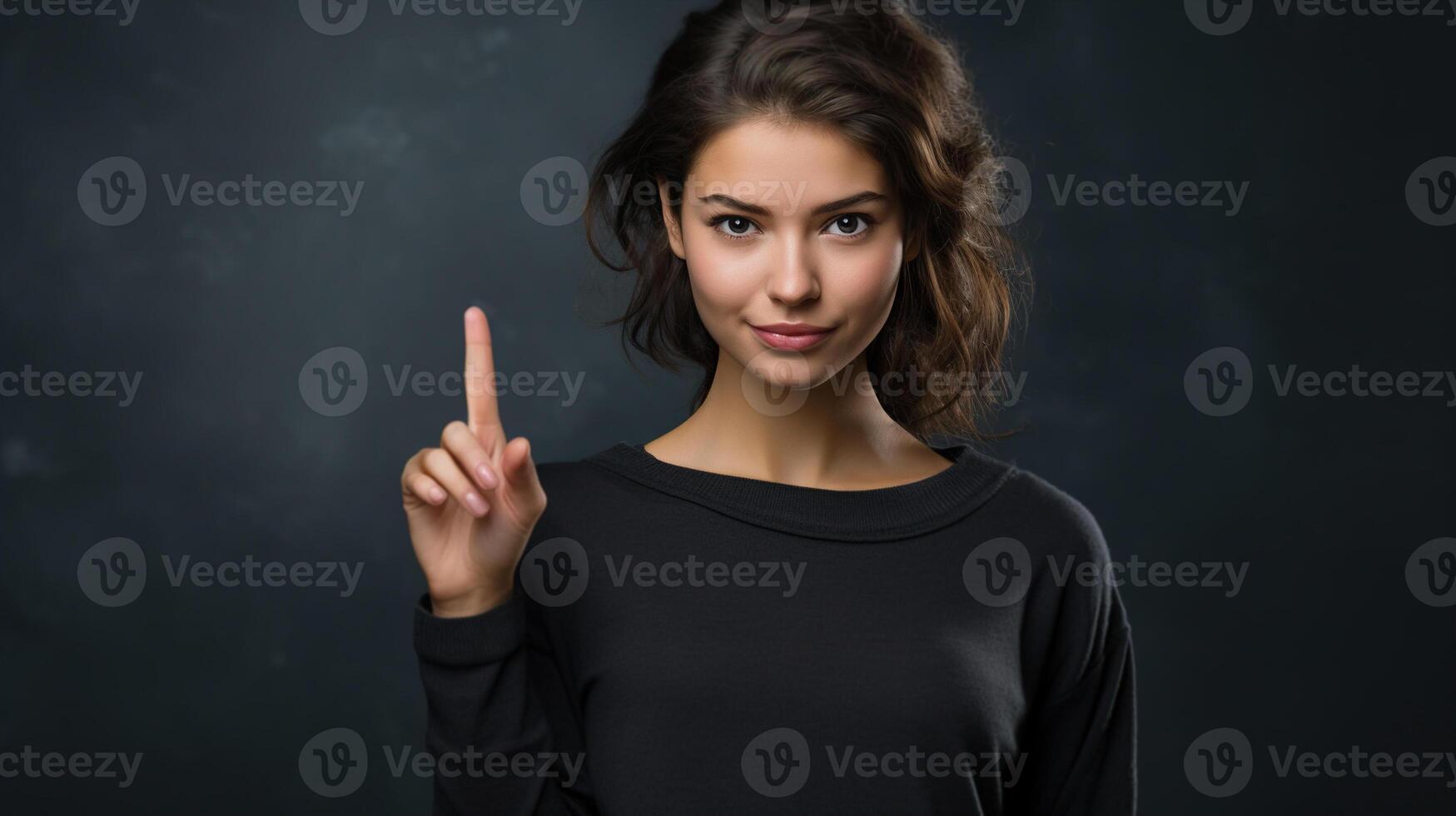 ai generado retrato de un joven mujer señalando su dedo arriba mientras en pie en un oscuro antecedentes y mirando a cámara foto