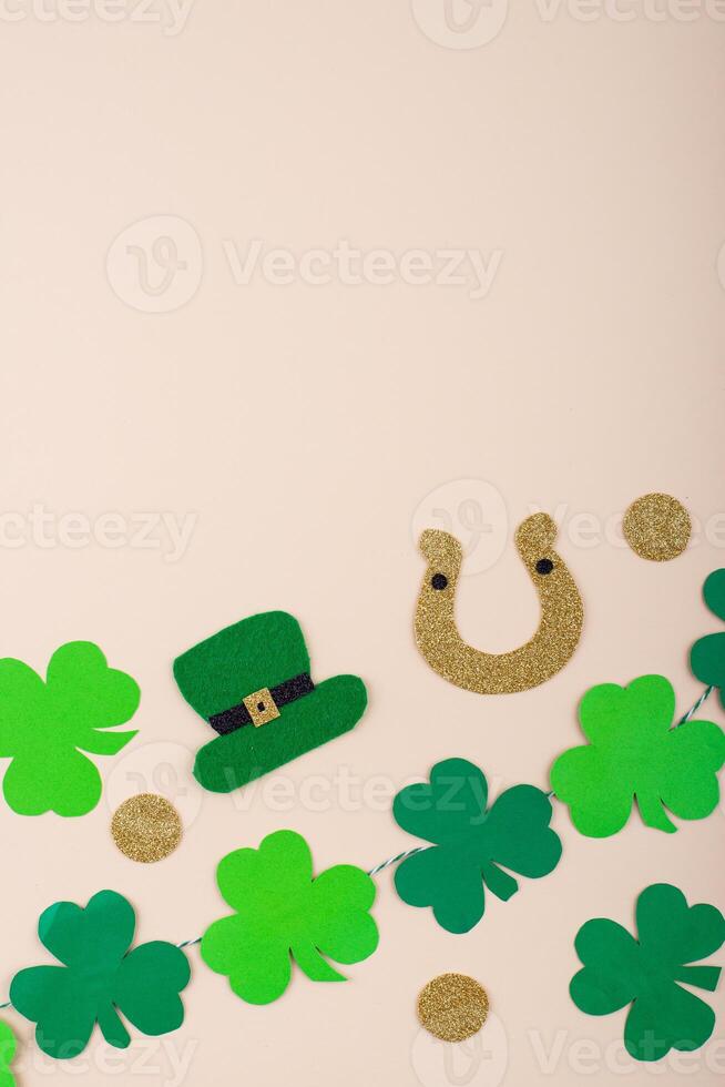 St. Patrick's Day concept with leprechaun hat, gold coins and horseshoe photo