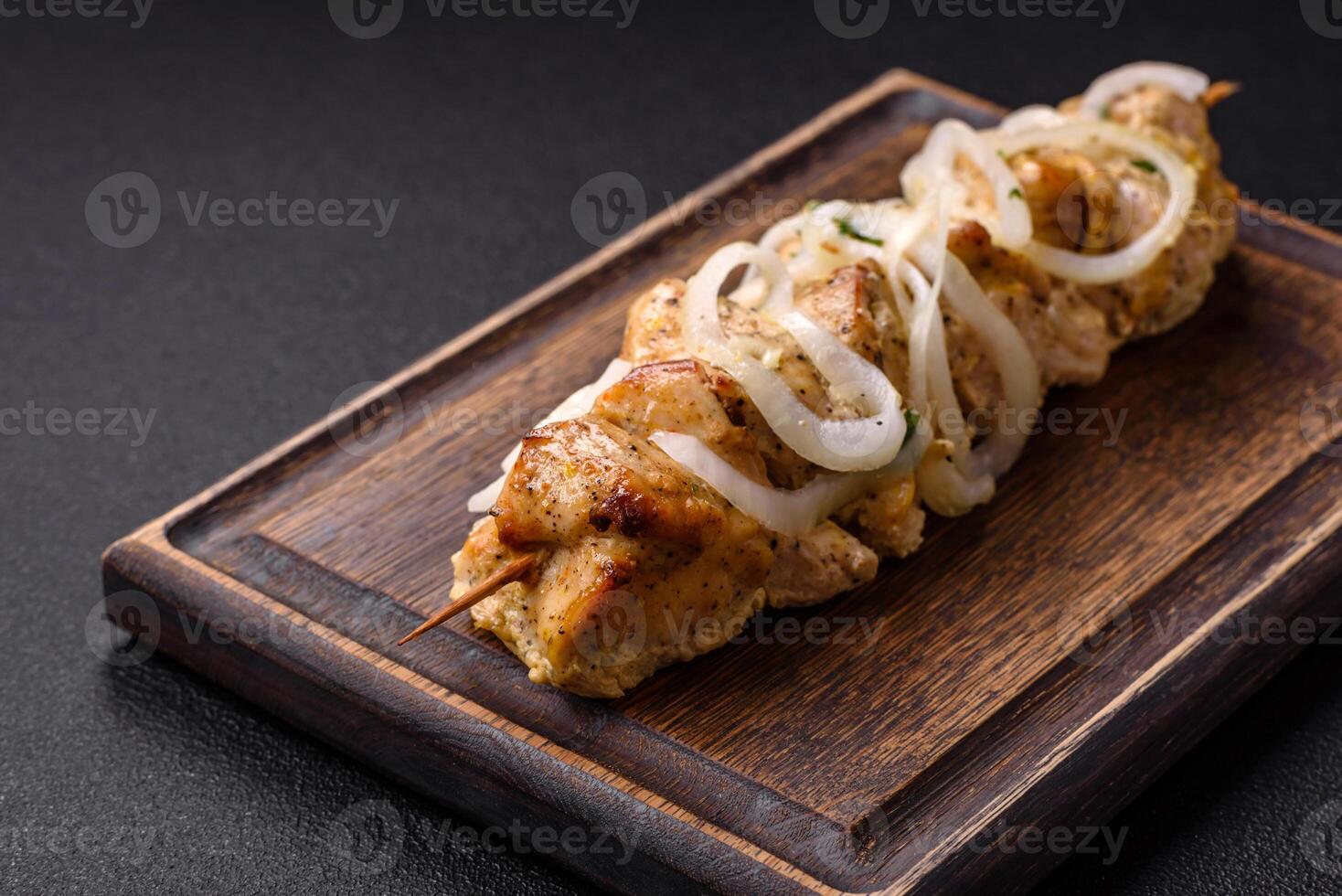 Delicious fresh chicken meat kebab with salt, spices and herbs photo