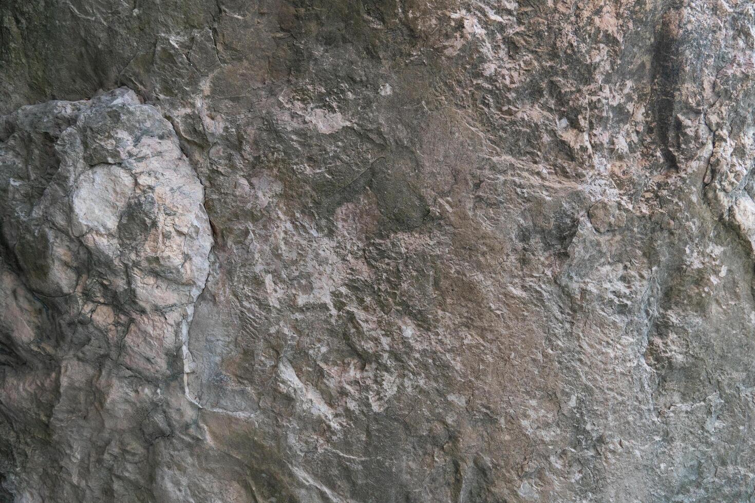 Stone floor has a unique rough surface and dark color. For background and textured. photo
