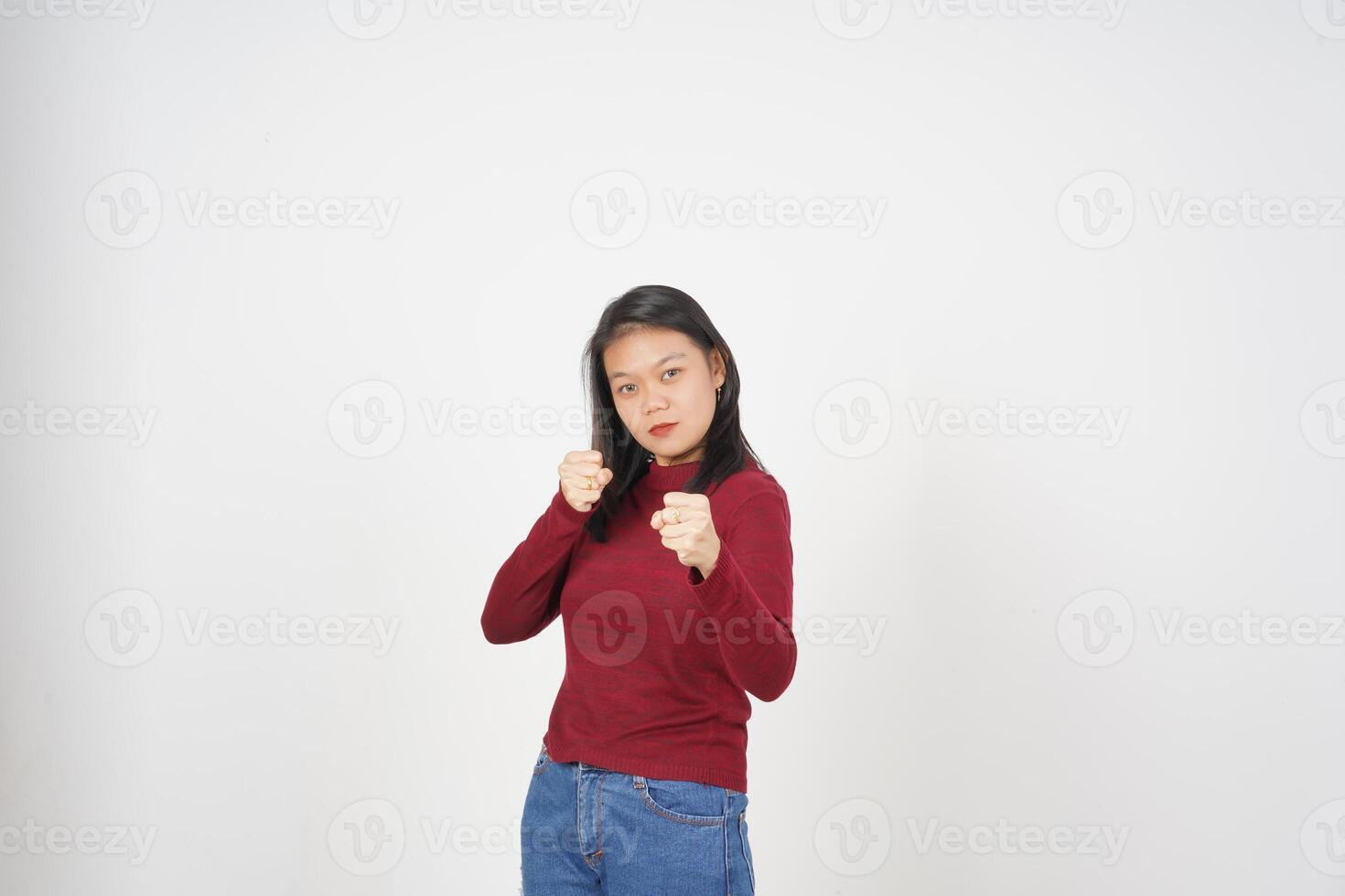 Young Asian woman in Red t-shirt Punching Fist to Fight isolated on white background photo