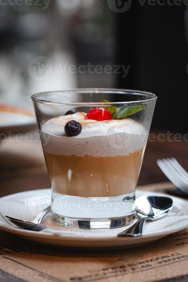 Suspiro a la lima dessert on a blurred restaurant background photo