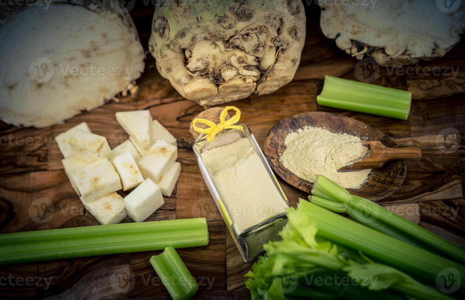 Fresh celery Apium graveolens on olive wood photo