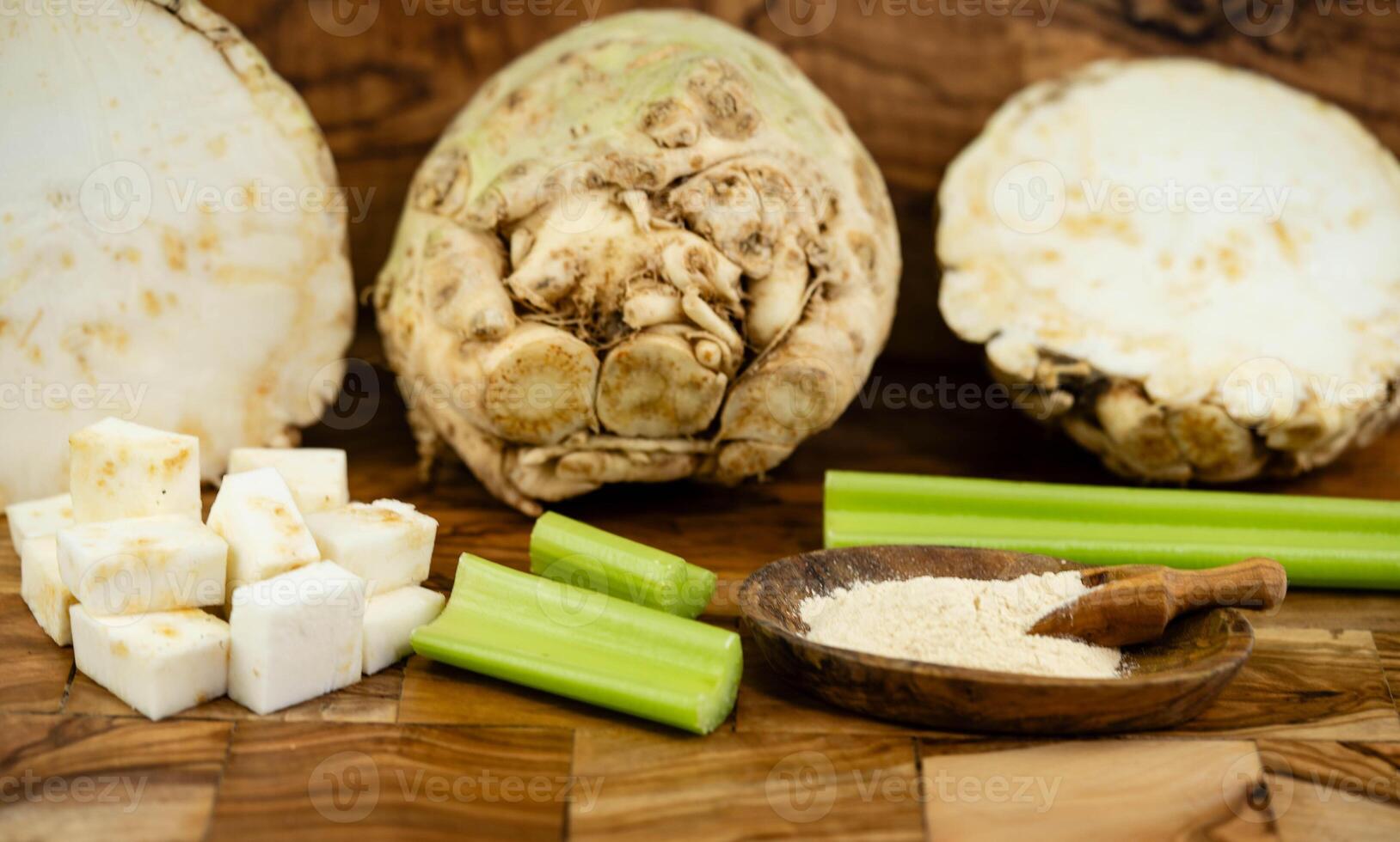 Fresh celery Apium graveolens on olive wood photo