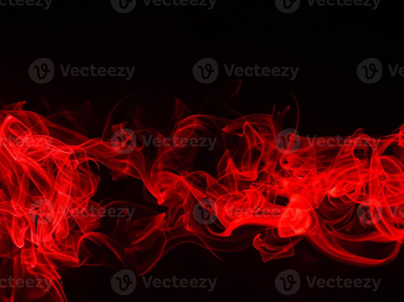 Red smoke on black background, fire design photo
