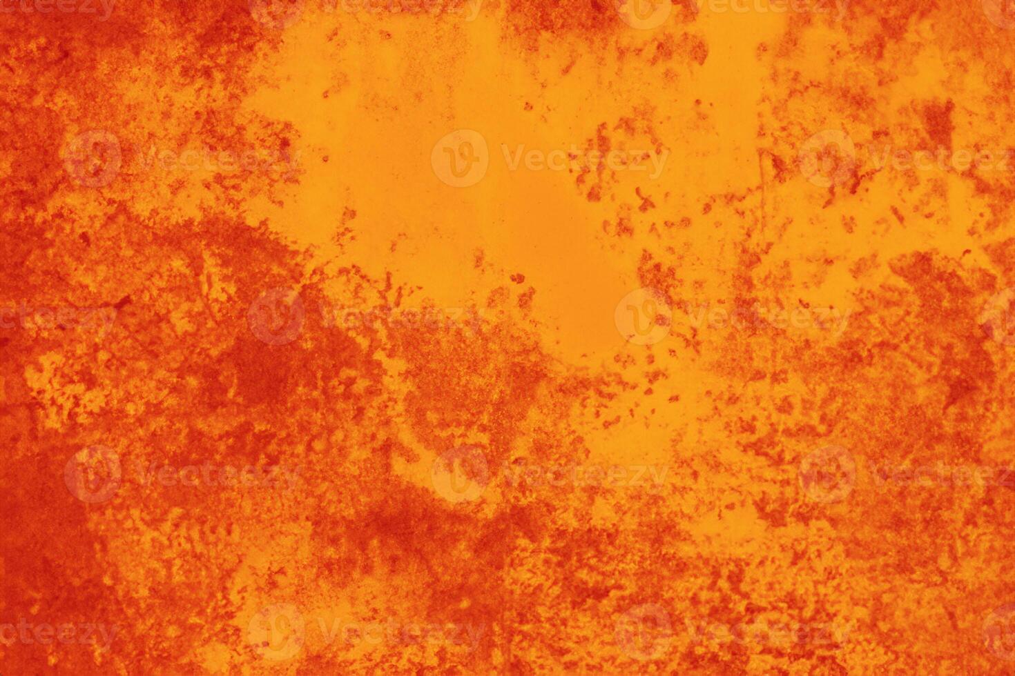 A grungy orange metal background and texture up close. photo