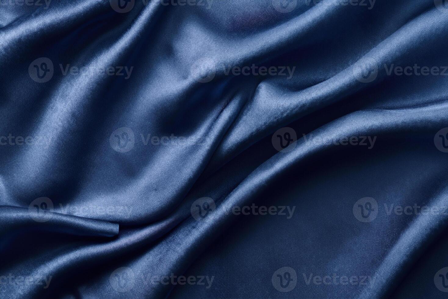 The background is made of silver silk, featuring folds that add depth and dimension. The abstract texture resembles the rippled surface of silk fabric. photo