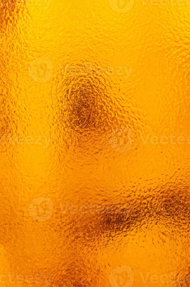 escarchado complejidad, hielo patrones en naranja vaso foto