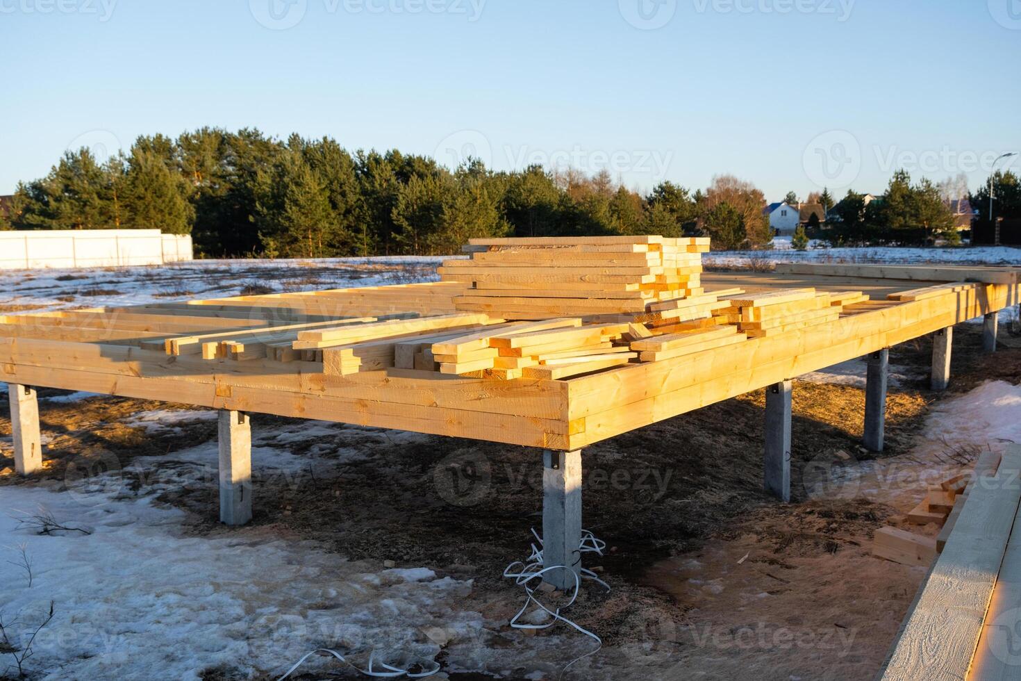 The foundation of a wooden frame house on stilts is a construction site, the process of building a frame photo
