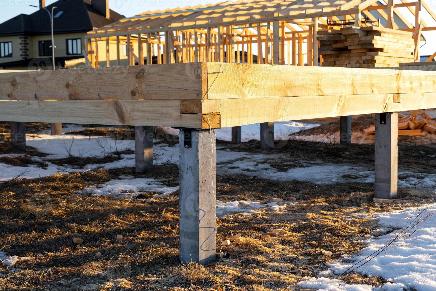 The foundation of a wooden frame house on stilts is a construction site, the process of building a frame photo