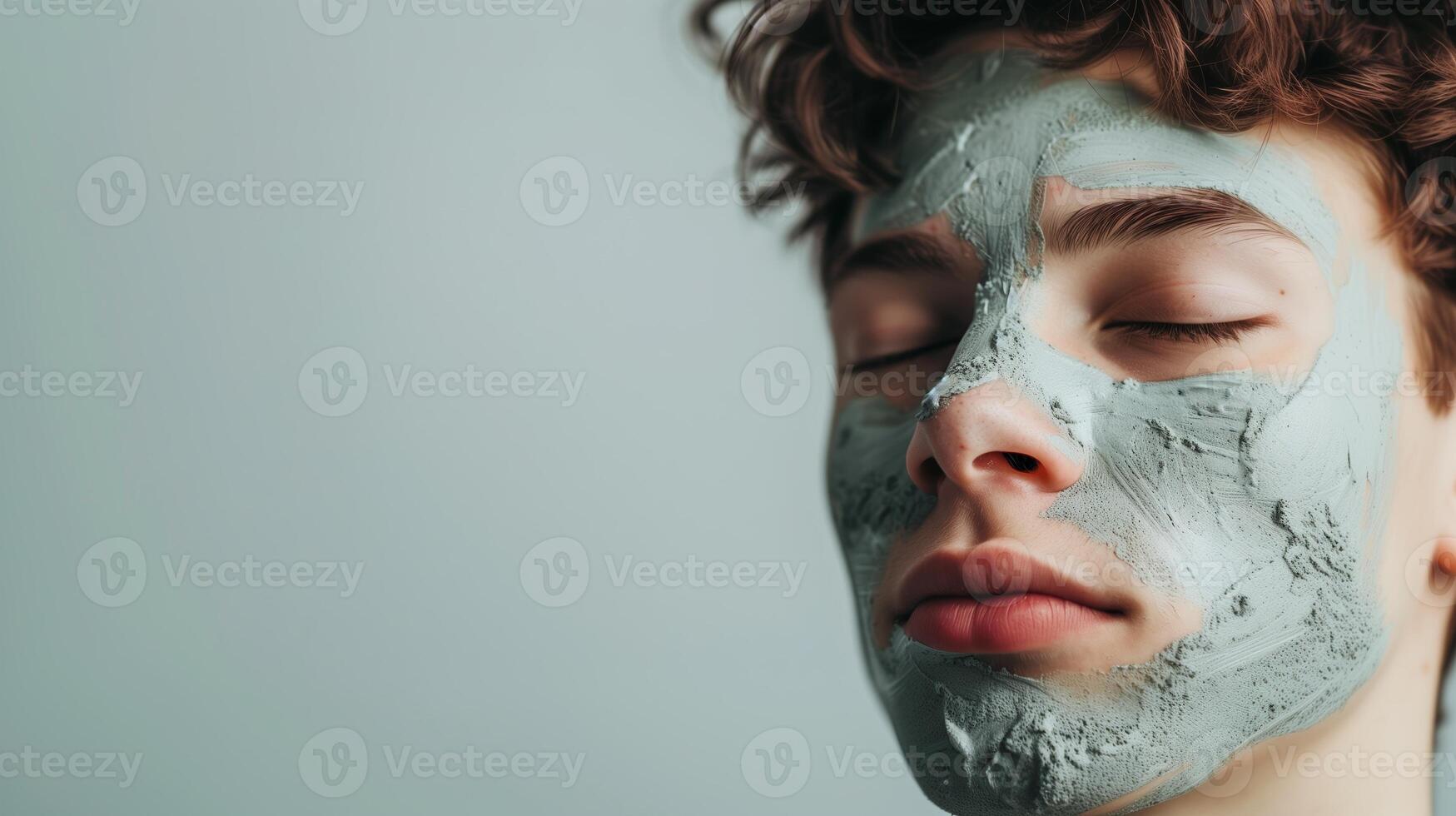 AI generated Young man with closed eyes and face mask on isolated background. Men's skin care or spa treatment. Generated by artificial intelligence. photo