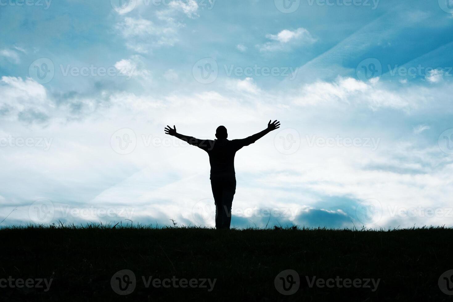 man silhouette in the countryside in the summer and sunset background photo