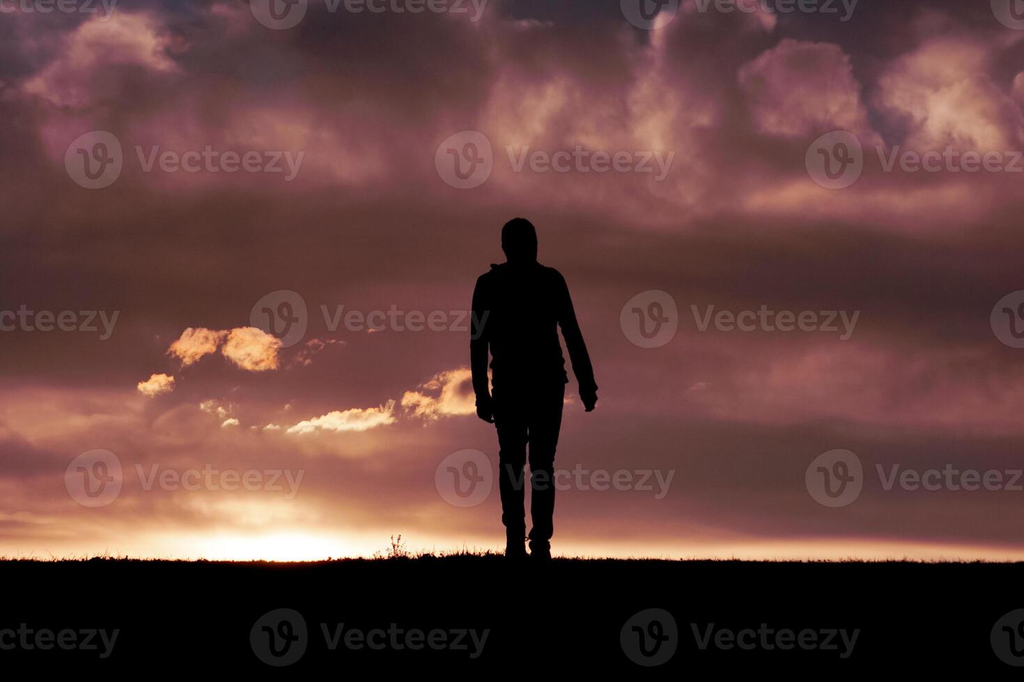 man silhouette in the countryside in the summer and sunset background photo