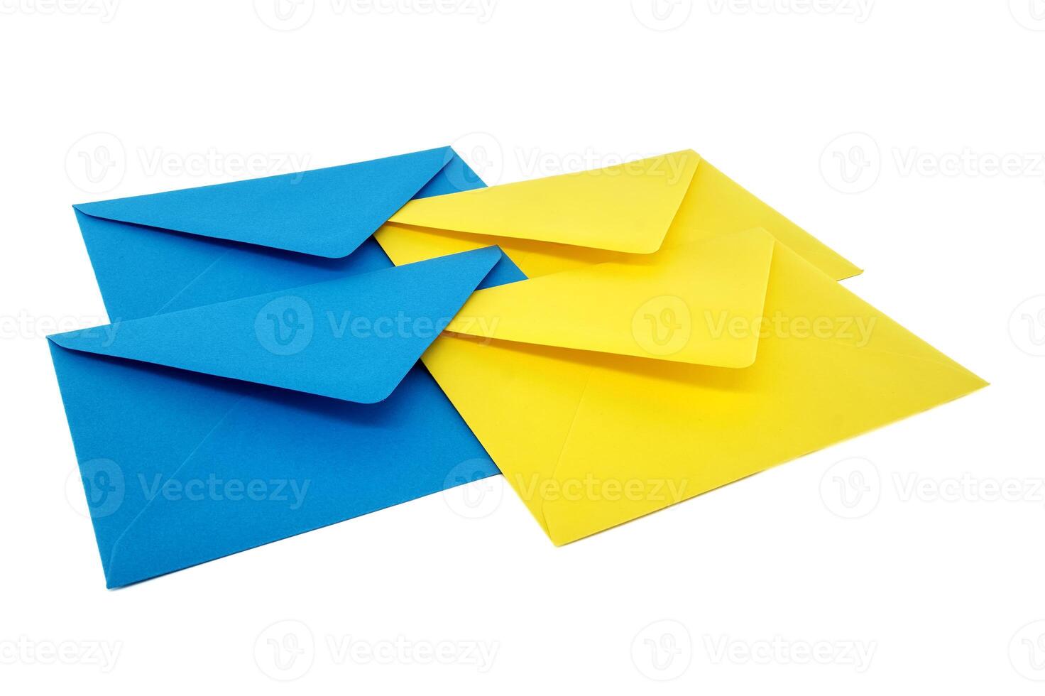 Blue and yellow paper envelopes arranged overt white photo