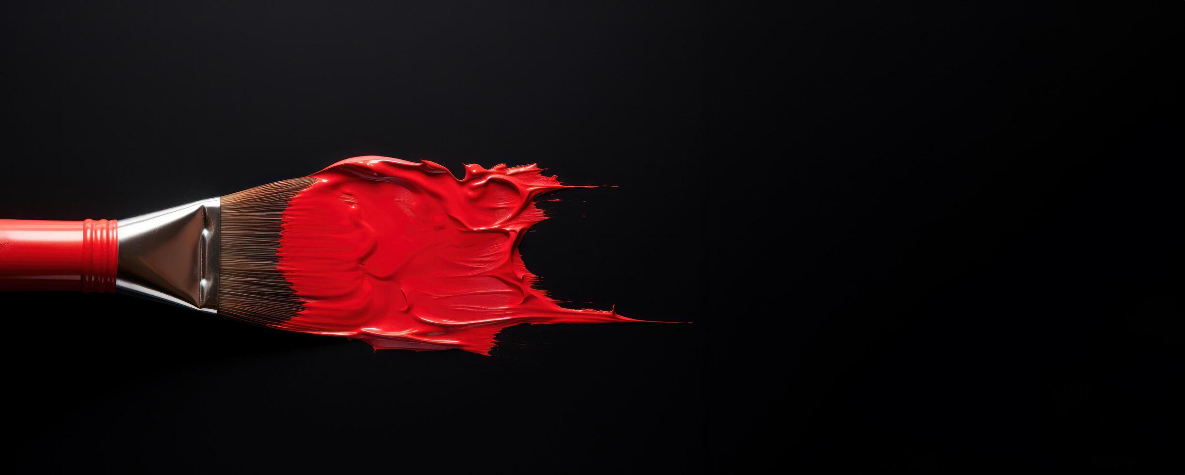 AI generated A red paintbrush dipped in paint against a dark black background photo