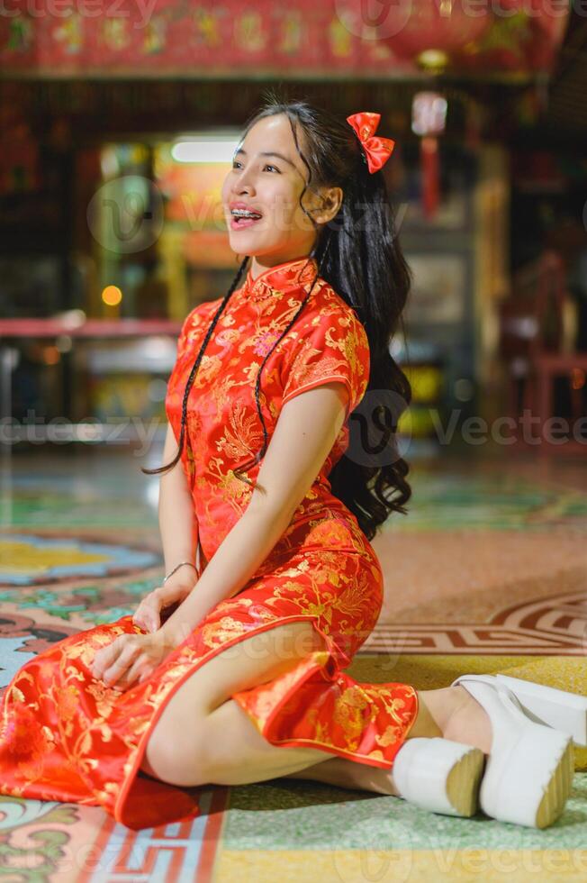 Asian beautiful woman Dress in Chinese style, Chinese New Year festival at night photo