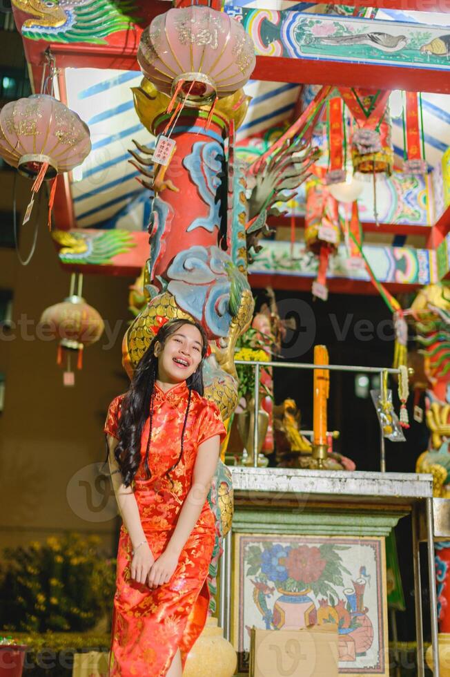 Asian beautiful woman Dress in Chinese style, Chinese New Year festival at night photo