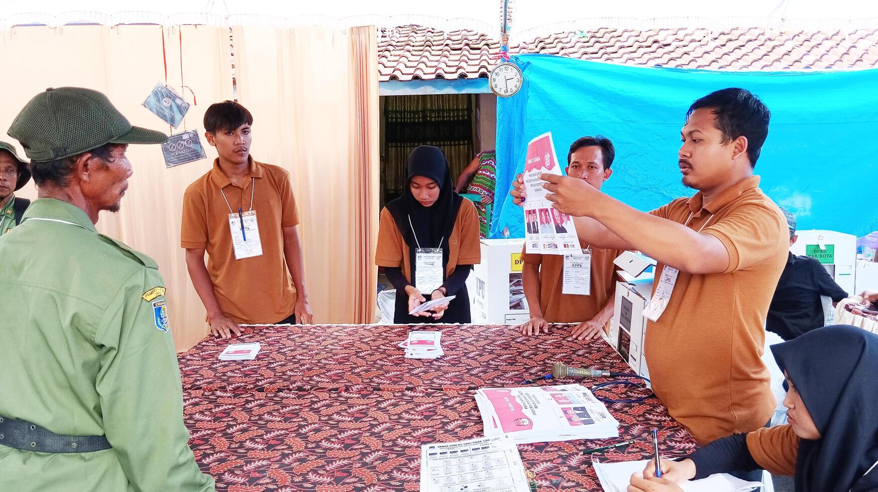 Demak, Indonesia - February, 2024 - Vote counting process at TPS, Indonesian presidential election. photo